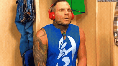 Man In Headphones And Blue Tank Top In Locker Room GIF
