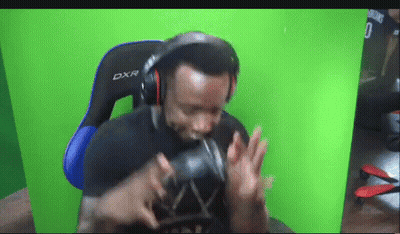 Man In Headphones And DXR Gaming Chair GIF