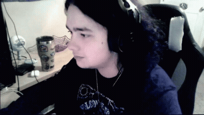 Man In Headphones And Falcons Shirt GIF