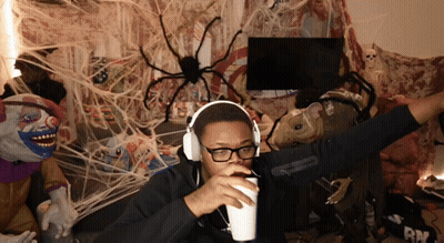 Man In Headphones And Glasses Holding Cup GIF