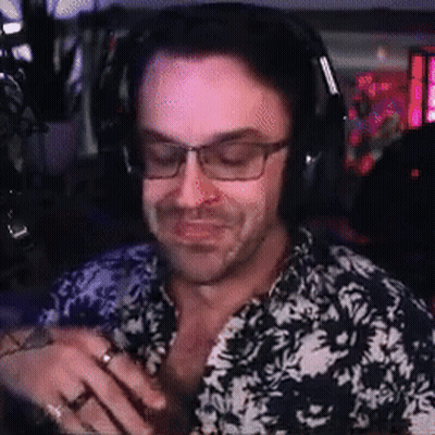 Man In Headphones And Glasses Smiling At Microphone GIF