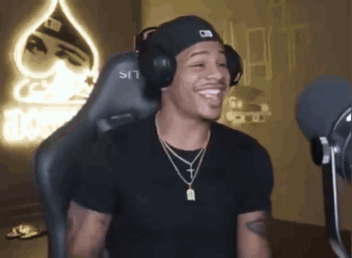 Man In Headphones And Hat At Microphone GIF