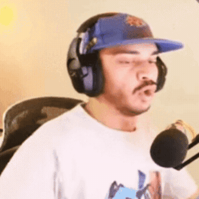 Man In Headphones And Hat At Microphone GIF