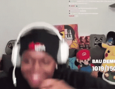Man In Headphones And Hat On Couch Saying Bau Demo GIF