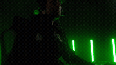 Man In Headphones And Hat Sitting At Computer GIF