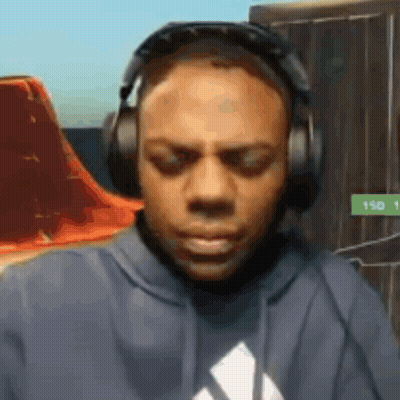 Man In Headphones And Hoodie Looking Down GIF