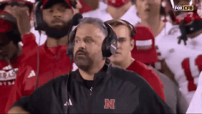 Man In Headphones And Jacket With Letter N Watching Football GIF