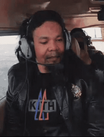 Man In Headphones And Kith T-Shirt GIF