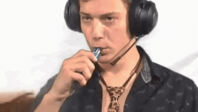 Man In Headphones And Leopard Tie Eating Lollipop GIF