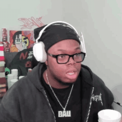Man In Headphones And Necklace Saying Bau GIF