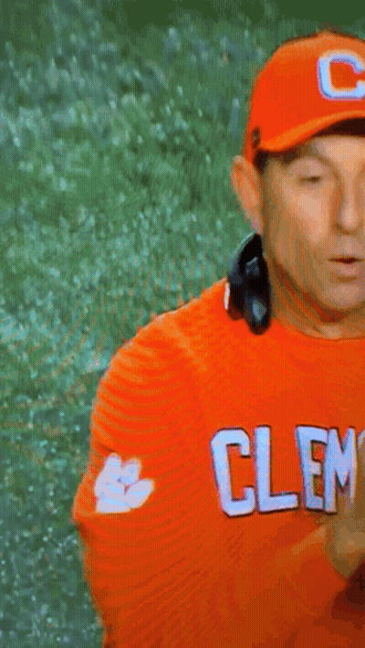 Man In Headphones And Orange Shirt Saying Cleveland GIF