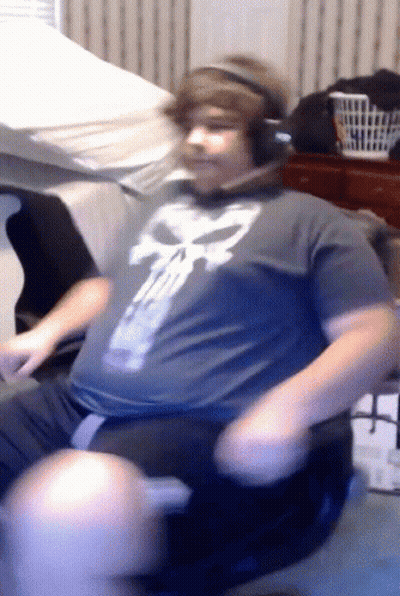 Man In Headphones And Punisher Shirt Sitting GIF