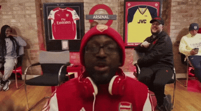 Man In Headphones And Red Arsenal Jacket GIF