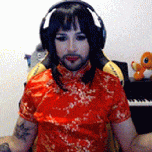 Man In Headphones And Red Dress At Piano GIF