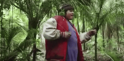 Man In Headphones And Red Jacket Standing In Woods GIF