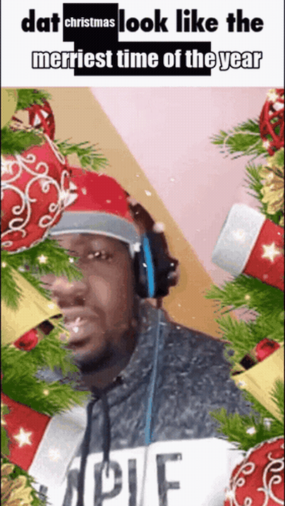 Man In Headphones And Santa Hat Saying Dat Christmas Look Like The Merriest Time Of The Year GIF