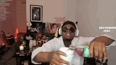 Man In Headphones And Sunglasses Pouring Drink GIF