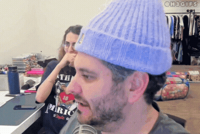 Man In Headphones And Sunglasses Wearing King Gizzard Shirt GIF