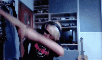 Man In Headphones And Supreme Shirt Dabbing GIF