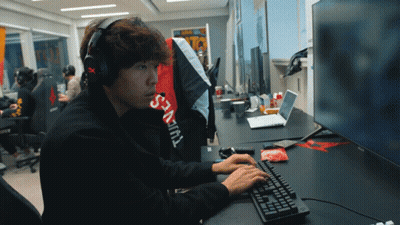 Man In Headphones And Supreme Shirt Typing GIF