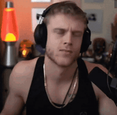 Man In Headphones And Tank Top Listening To Music GIF