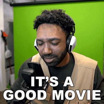 Man In Headphones And Vest Says It's A Good Movie GIF