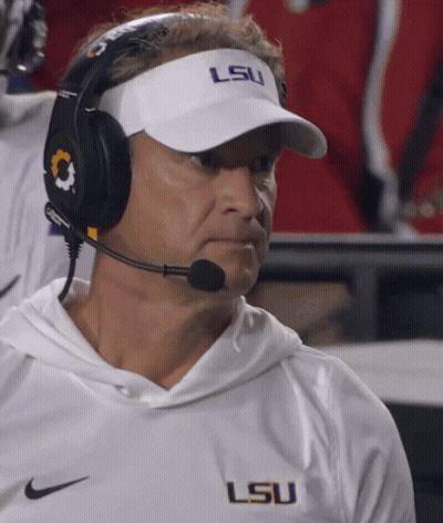 Man In Headphones And Visor Saying LSU GIF