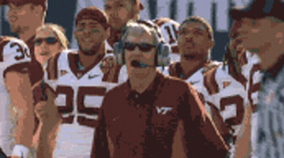 Man In Headphones And VT Shirt With Football Team GIF
