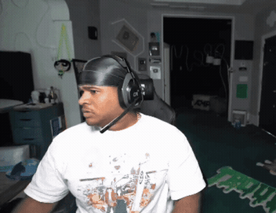 Man In Headphones And White Shirt Saying Mighty GIF