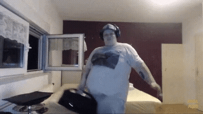 Man In Headphones And White Shirt Standing In Room GIF