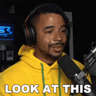 Man in Headphones and Yellow Hoodie Saying Look at This