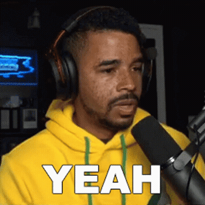 Man in Headphones and Yellow Hoodie Saying Yeah