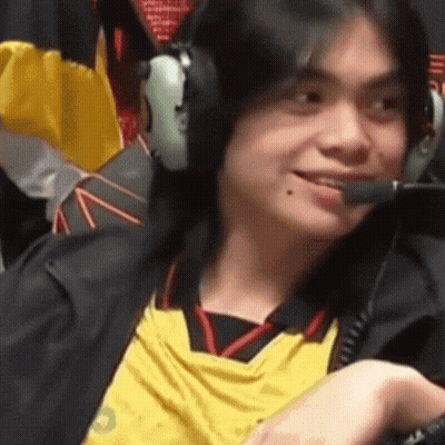 Man In Headphones And Yellow Shirt Smiling Into Microphone GIF