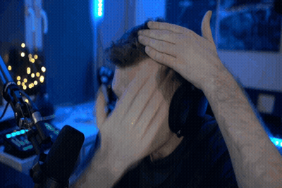 Man In Headphones Covering Face At Microphone GIF