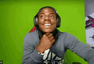 Man In Headphones Covering Mouth GIF