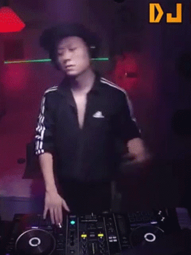 Man in Headphones Dancing at DJ Mixer