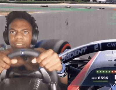 Man In Headphones Driving Race Car With Trident 21 GIF