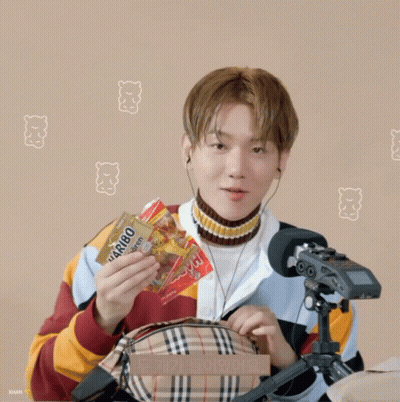 Man In Headphones Holding Burberry Bag At Microphone GIF