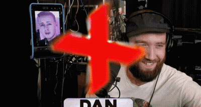 Man In Headphones In Front Of Red Cross Saying Dan GIF