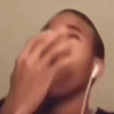Man In Headphones Laughing Covering Face GIF