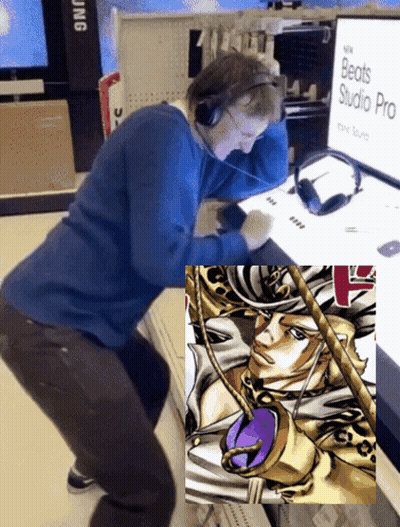 Man In Headphones Looking At Beats Studio Pro Monitor GIF