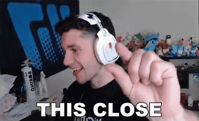 Man In Headphones Making Funny Face Saying This Close GIF