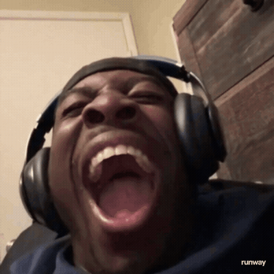 Man In Headphones Making Funny Face With Runway GIF