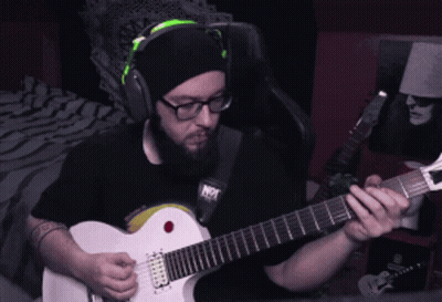 Man In Headphones Playing Guitar Saying Not GIF