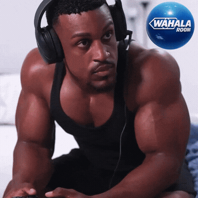 Man In Headphones Playing Video Game Next To Wahala Rocket GIF