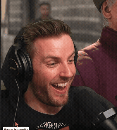 Man In Headphones Shirt Says Pause GIF