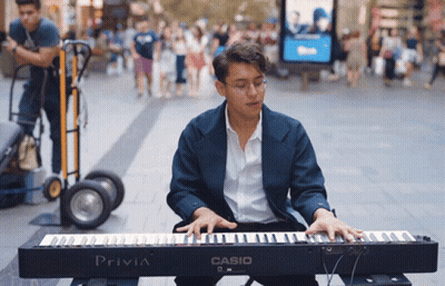 Man In Headphones Sitting By Heartbeat Monitor GIF