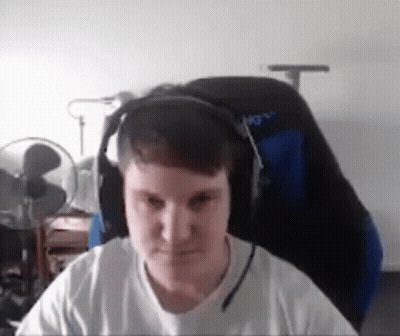 Man In Headphones Sitting In Chair GIF