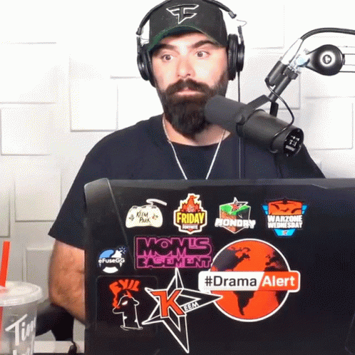 Man In Headphones Sitting In Front Of Laptop With Drama Alert Sticker GIF
