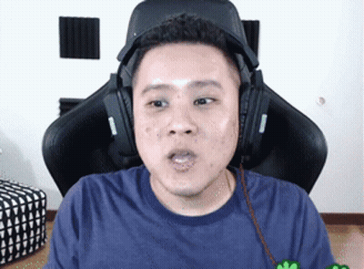 Man In Headphones Sitting In Gaming Chair GIF